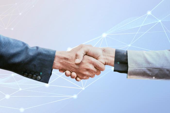 two businessmen shaking hands financial advisor transitions