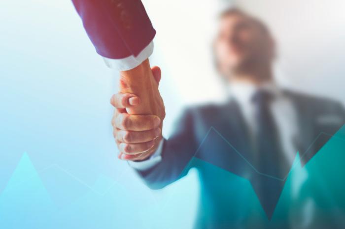 two businessmen shake hands financial advisor transitions 