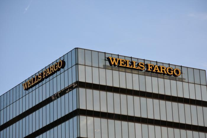 wells fargo skyscraper with logo financial advisor transitions